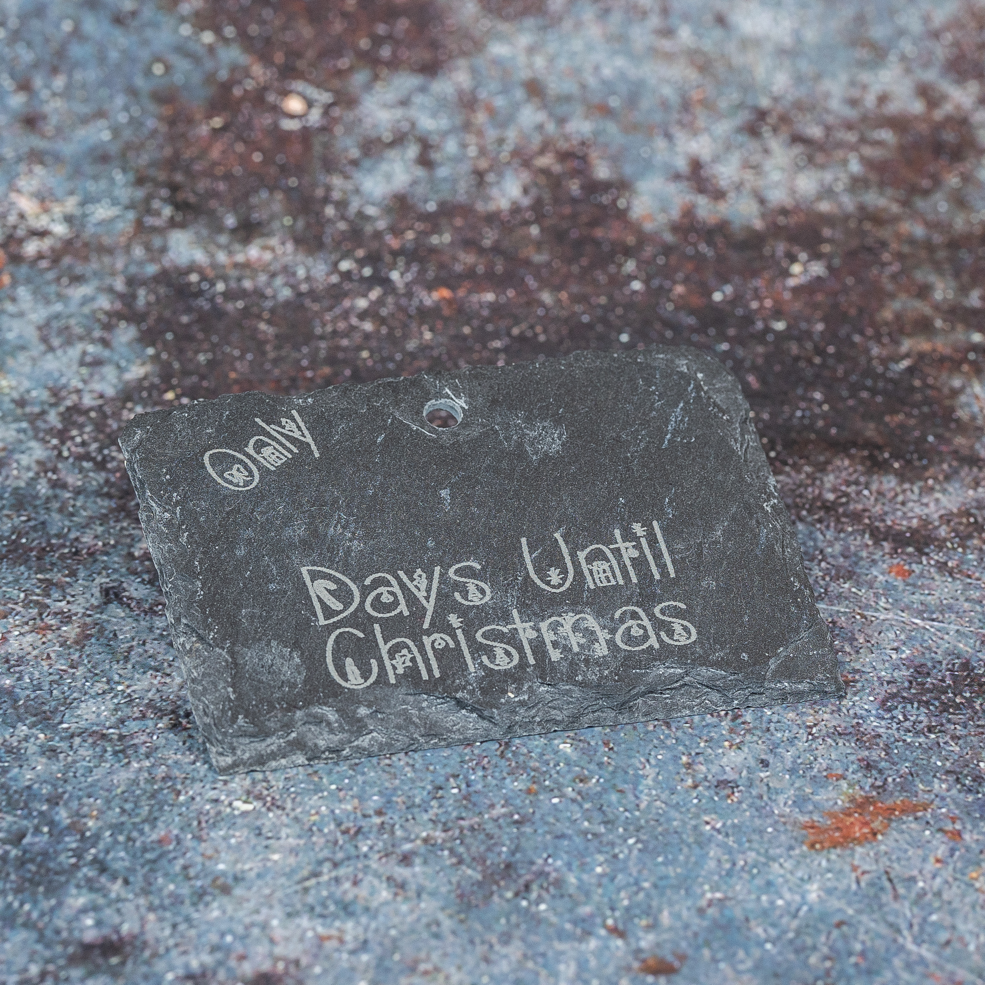 Slate sign with Only (blank) days until Christmas in Christmas present style writing.