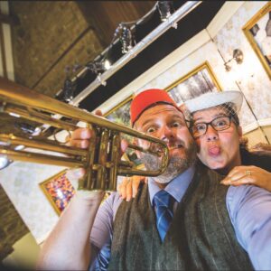Image of a man and woman with a trumpet.