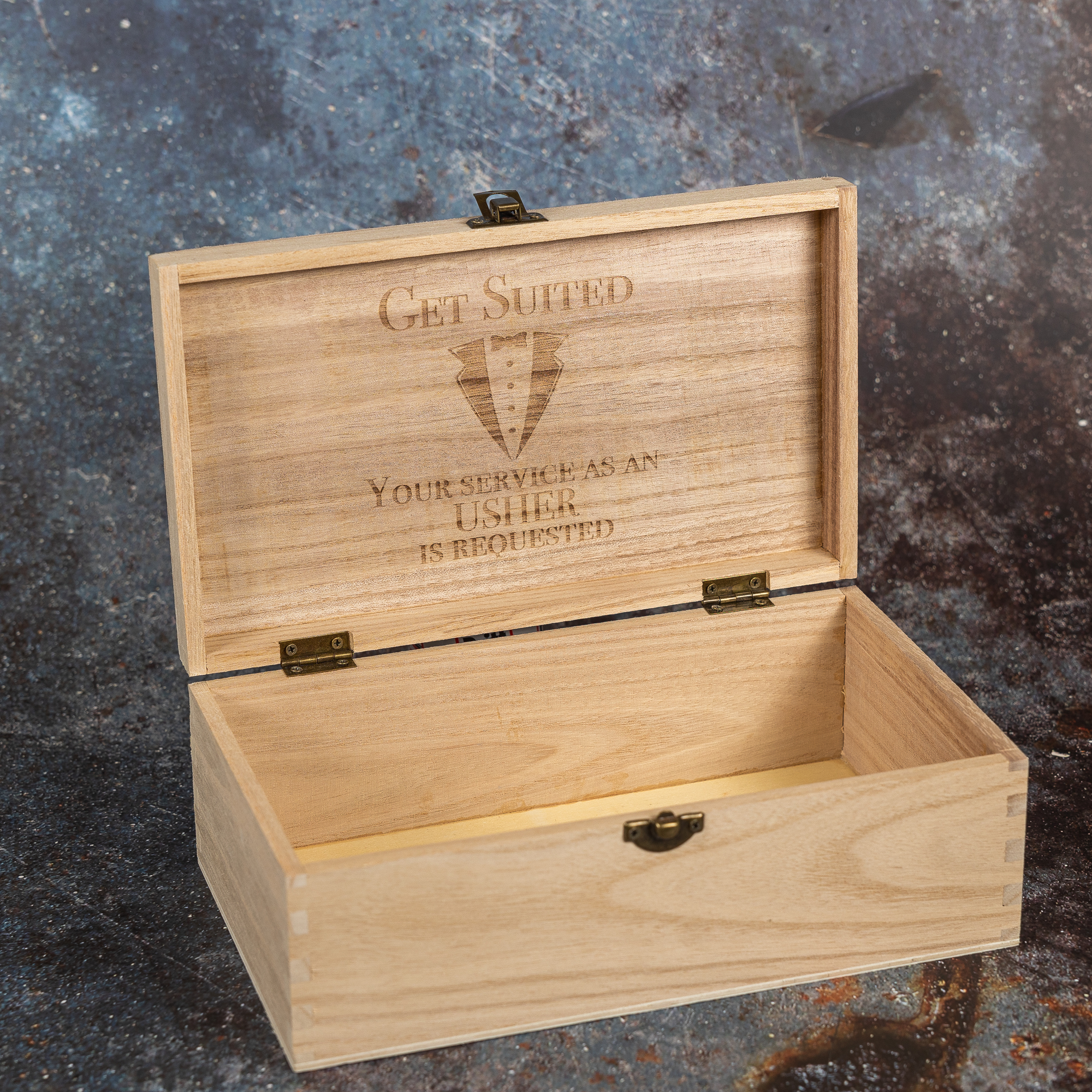 Wooden box with open lid and engraving inside the lid. Quoting Get Suited, your service as an usher is required.