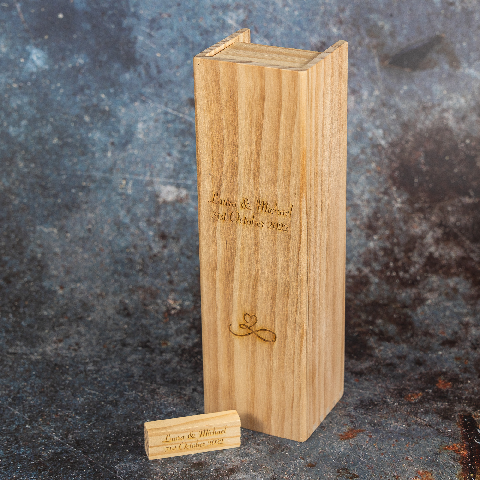 Wooden tumble tower outer box with tumble tower brick engraved with wedding couples' details.