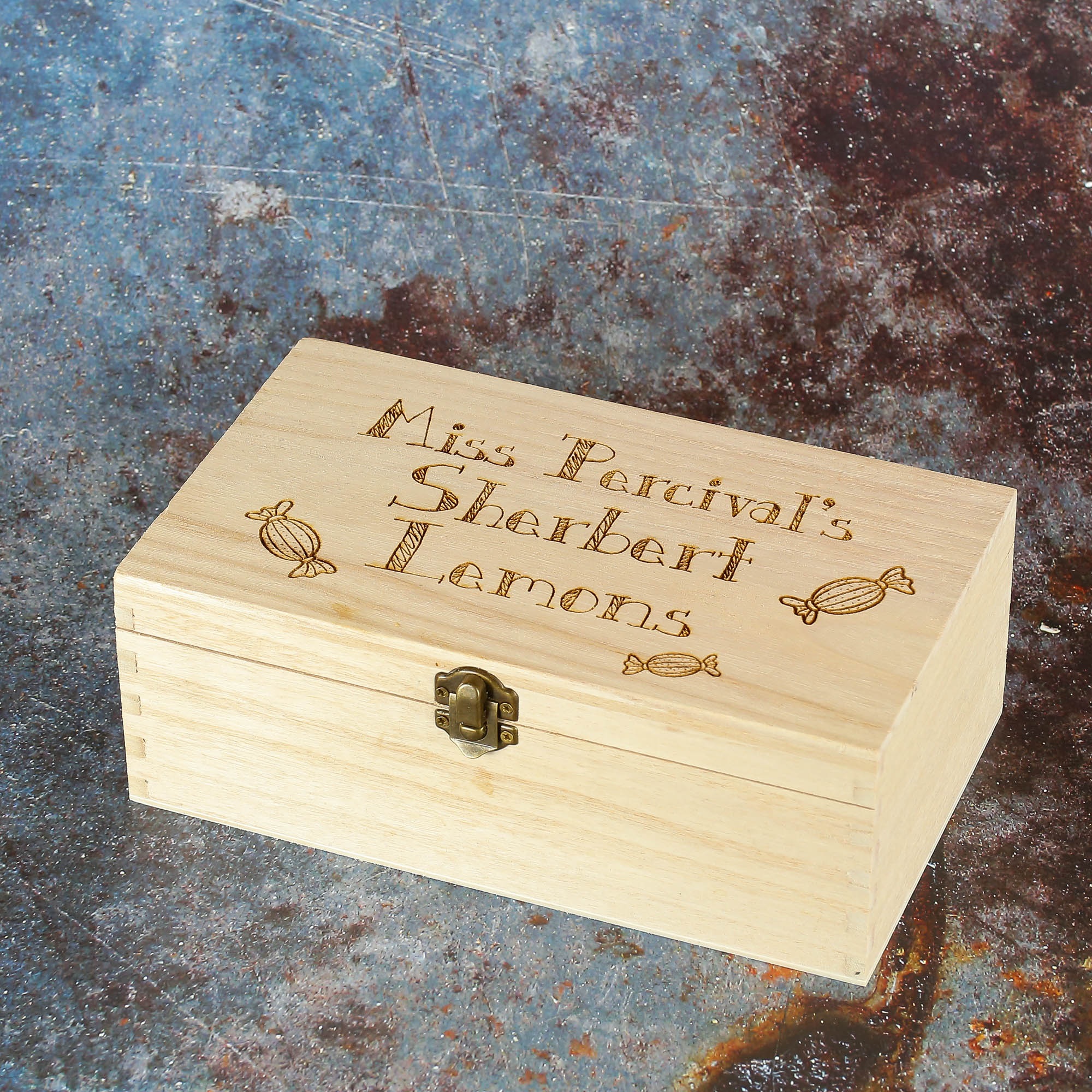 Personalised wooden storage box engraved with text and sweet imagery.