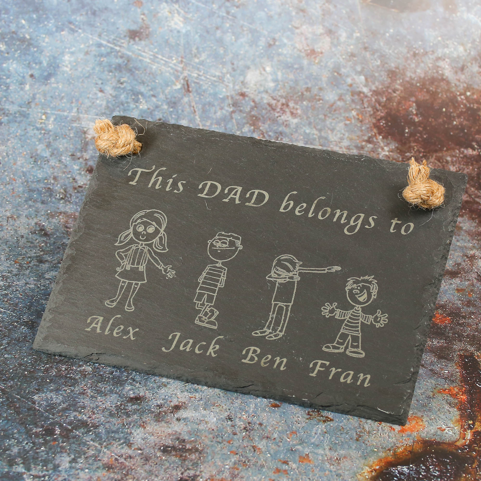 Hanging slate sign with jute rope. Text says This Dad Belongs to and then images of characters and their names.