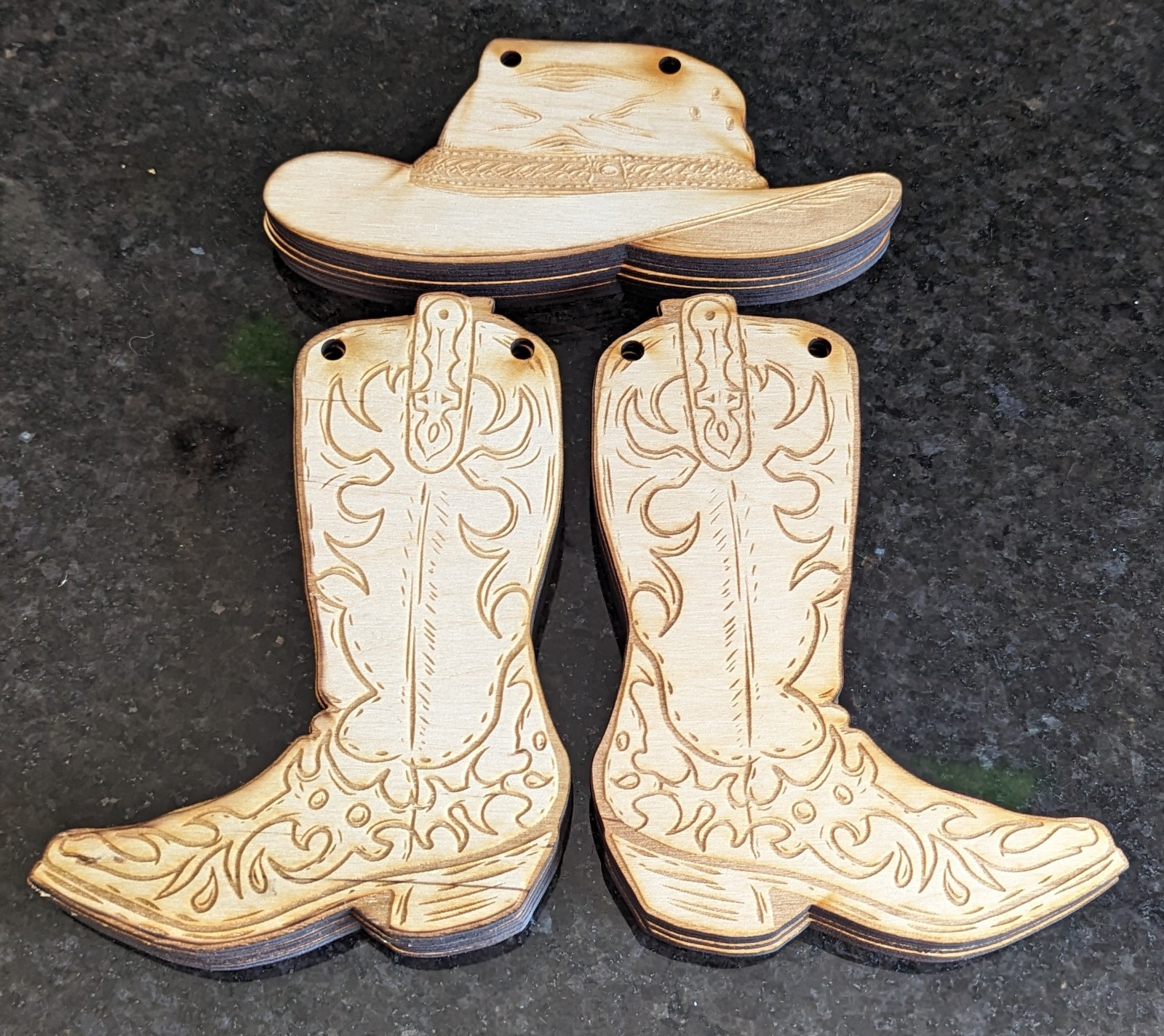 Wild West Bunting Wooden cut outs of cowgirl hat and boots.