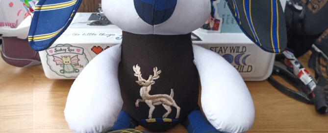 Stuffed memory rabbit created from ties, a shirt and a blazer pocket.