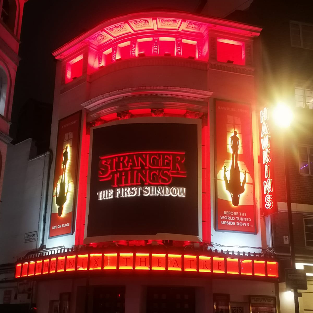 Outside of theatre showing sign for Stranger Things The First Shadow.