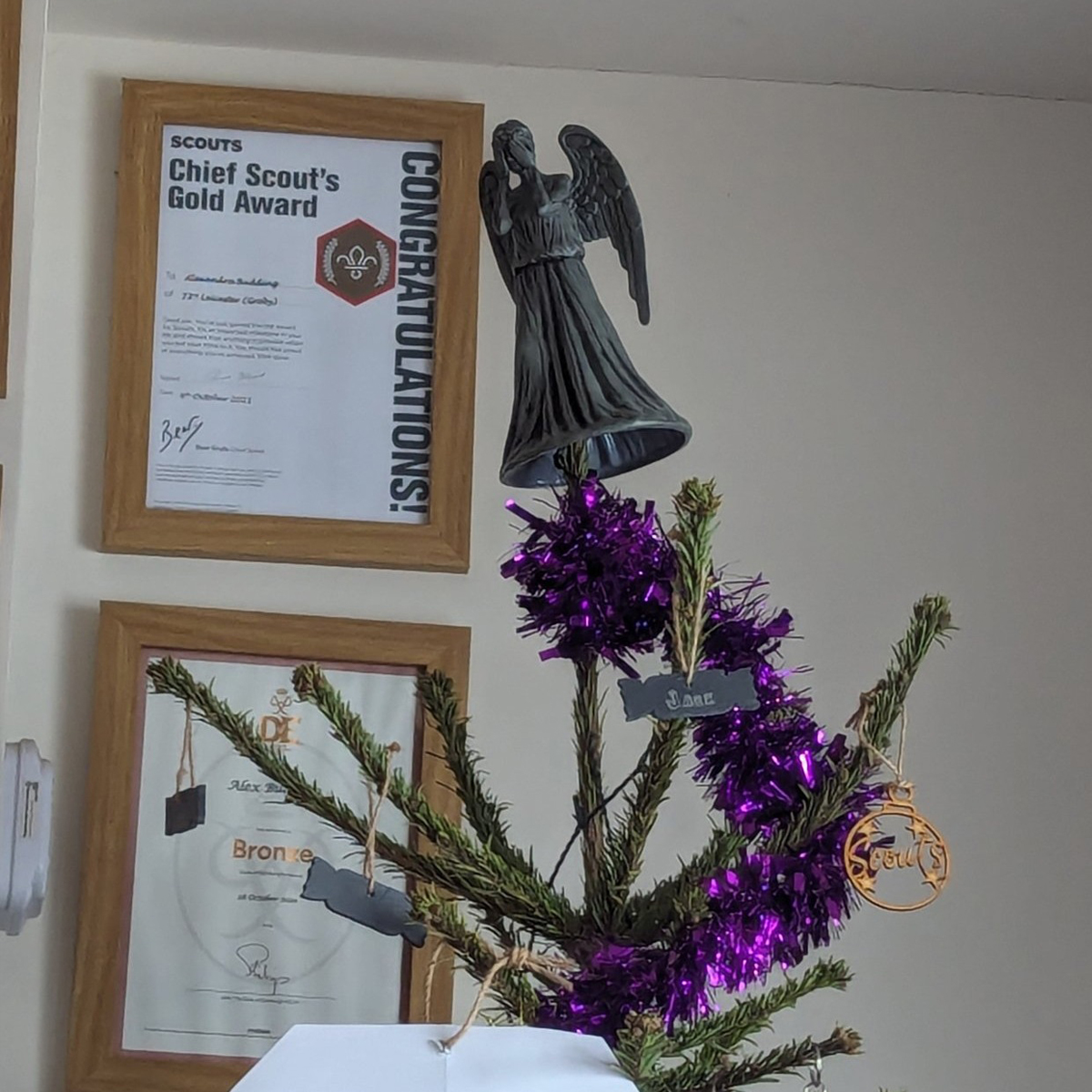Weeping angel on top of a Christmas tree
